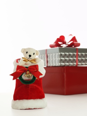 teddy bear, christmas boot, and presentの写真素材