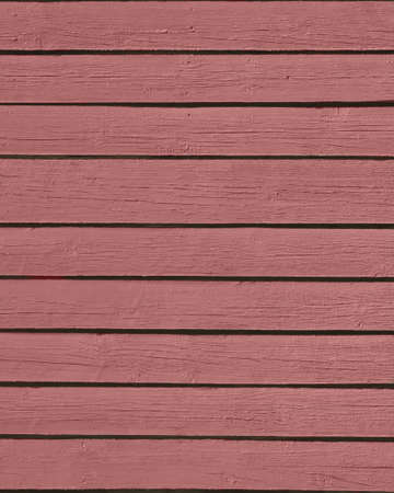 Brown pink painted wooden boards texture background.の写真素材