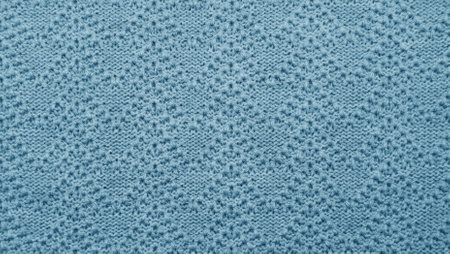 Blue knitted pattern fabric texture backgroundの写真素材