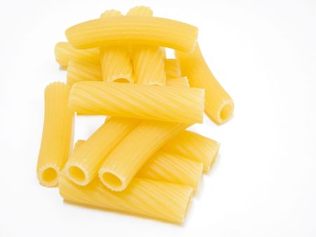 Food: This is a composition of long hollow tube shaped Pasta isolated on white. の写真素材