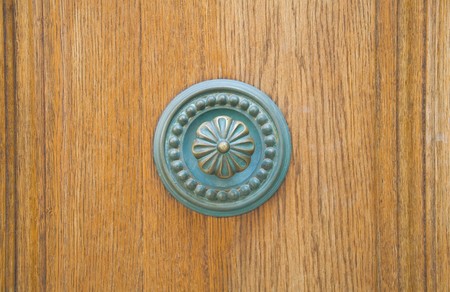 Doorknob on all wood door.の写真素材