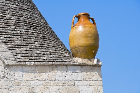 Close up of a terracotta water jug. Alberobello. Apulia.の写真素材