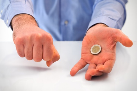 Man playing with euro coin.の写真素材