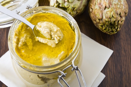 Artichoke pesto in glass jar.の写真素材