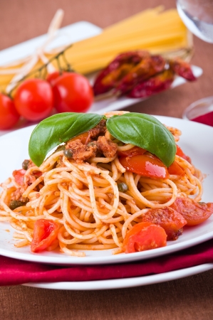 Spaghetti with tuna, cherry tomatoes and capers. の写真素材