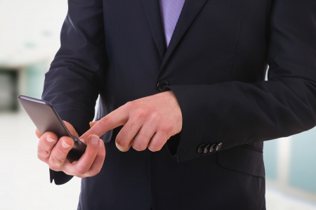 Business man using cellphone の写真素材