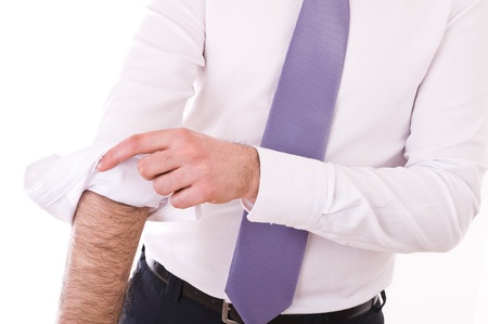 Business man rolling up sleeves 