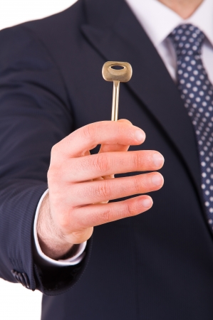Businessman holding key の写真素材