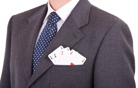 Businessman with playing cards in his pocket の写真素材