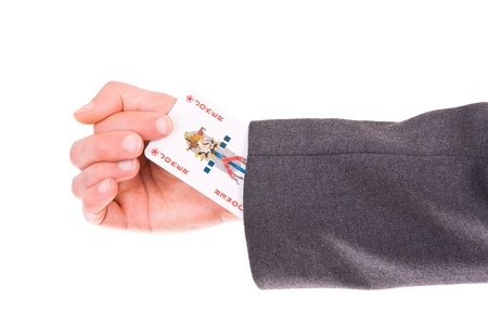 Businessman with Joker card hidden under sleeve のeditorial素材