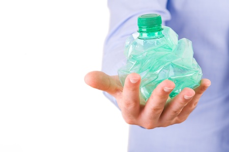 Businessman holding a crushed bottle.