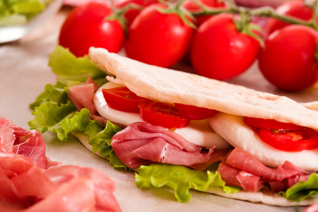 Piadina with ham and lettuce.の写真素材