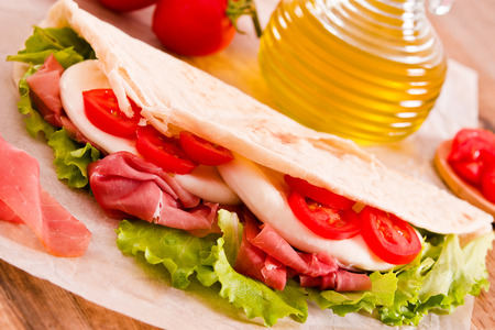 Piadina with ham and lettuce. の写真素材