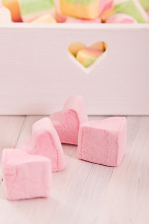 Marshmallows on wooden table. の写真素材