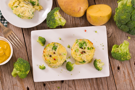 Potato gratins with broccoli florets.の写真素材