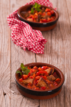 Marinated pork loin in tomato sauce.の写真素材