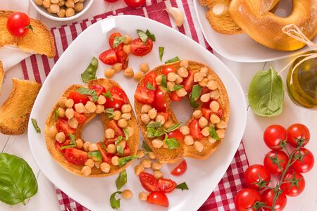 Friselle with tomatoes and chickpeas.の写真素材