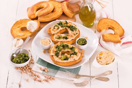 Friselle with turnip tops and hummus.