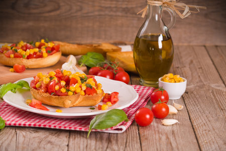 Friselle with tomatoes and mais.の写真素材