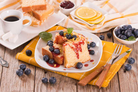 Lemon cake with blueberries and mint.