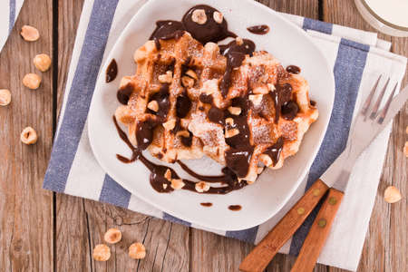 Waffles with chocolate cream and hazelnuts.の写真素材