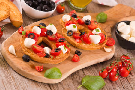 Friselle with tomatoes and mozzarella cheese.の写真素材