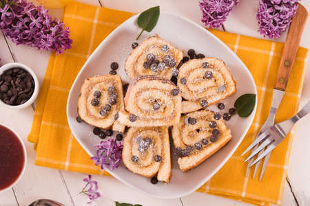 Swiss roll cake with chocolate chips.