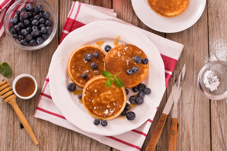 Pancakes with blueberries and chocolate cream.の写真素材