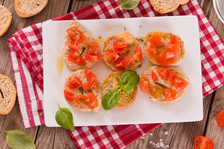 Friselle with cherry tomatoes and basil.の写真素材