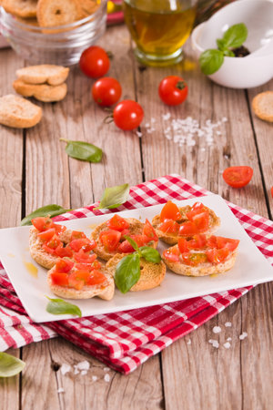 Friselle with cherry tomatoes and basil.の写真素材