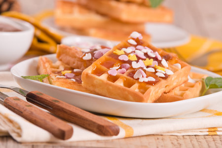 Waffles with jam and confetti.の写真素材
