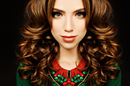 Fashiom Portrait of Curly Hair Woman. Girl with Hairstyle and Makeupの写真素材