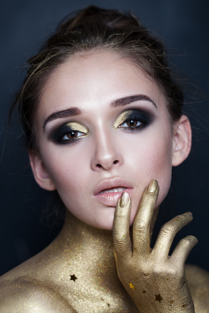 Portrait of Sexy Fashion Woman. Makeup with Gold Starsの写真素材