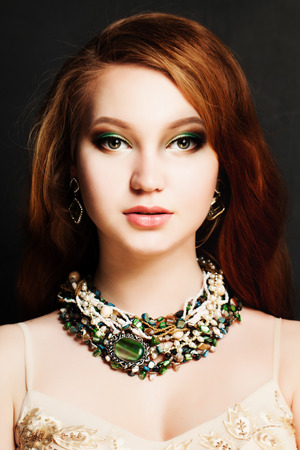 Beautiful Woman with Red Hair and Makeupの写真素材