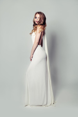 Romantic Blonde Beauty in White Dress. Fashion Portraitの写真素材