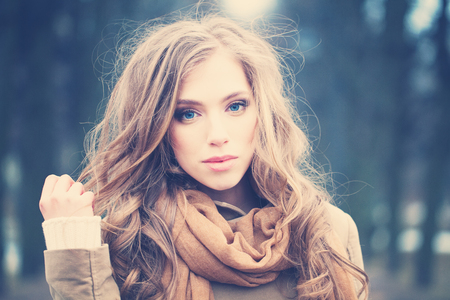 Vintage Portrait of Beautiful Woman Outdoorsの写真素材