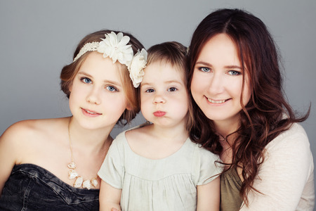 Females Family. Happy Mother and  Daughters (3 and 10 years old)の写真素材