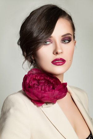 Woman with Fashion Makeup and Hairstyle. Beautiful Young Woman portrait. Beauty Girl Face.の写真素材
