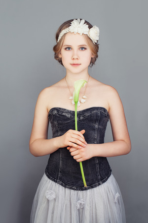 Fashion Model Girl. Fashionable Teenager Girl Wearing a Strapless Princess Prom Dress and Bohemian Boho Chic Hairstyleの写真素材