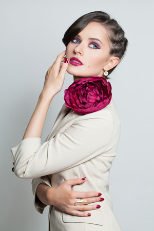 Fashion Model Beautiful Woman with Fashion Hairstyle and Bright Makeup. Portrait of Sexy Girl on Backgroundの写真素材