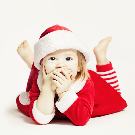 Happy Baby in Santa Hat. Infant Child Laughingの写真素材