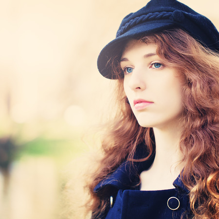 Woman with Red Curly Hair Outdoorsの写真素材