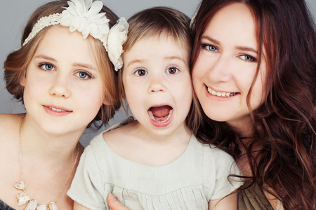 Beautiful Mother and Daughters. Cute Girls (3 and 10 years old)の写真素材