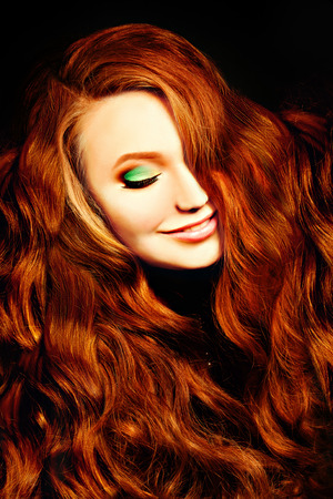 Portrait of Red Curly Hair Girl Fashion Model. Redhead Womanの写真素材