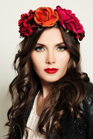 Beautiful Woman in Red Flowers Wreathの写真素材