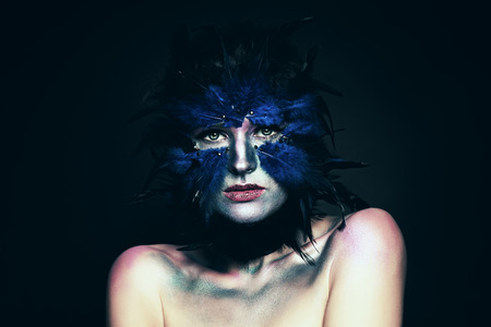 Carnival costume. Woman with Fantasy Makeup. Blue Bird Maskの写真素材
