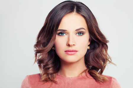 Perfect Beauty. Beautiful Woman Fashion Model with Makeup and Curly Hairstyleの写真素材
