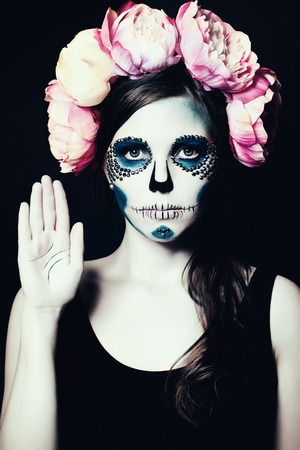 Girl with Halloween Makeup. Sugar Skull Beautiful Womanの写真素材