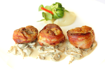 Meat in bacon with garnish, gourmet restaurant foodの写真素材