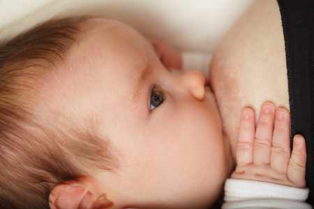 Breastfeeding - baby, face closeupの写真素材
